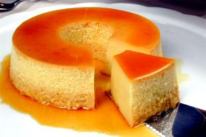 Quantas calorias em 1/2 colher de sopa (5,7 g) Pudim de Coco?