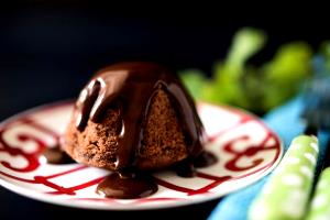 Quantas calorias em 1 colher de sopa (7 g) Pudim de Chocolate?