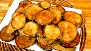Quantas calorias em 1 Polegada Cúbica Empanado de Berinjela?