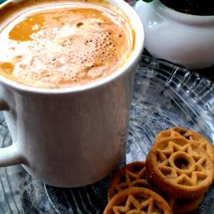 Quantas calorias em 1 Porção Café?