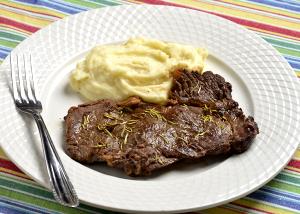 Quantas calorias em 1 Porção Carne boi sem gordura capa de contra-filé grelhada sem sal?