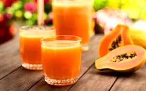 Quantas calorias em 1 Porção Mamão suco natural (néctar) com açúcar refinado?