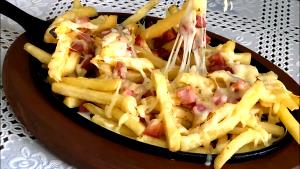 Quantas calorias em 1 Porçoes Batata Com Presunto E Queijo?