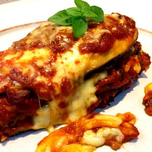 Quantas calorias em 1 Porçoes Beringela À Parmegina?