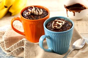 Quantas calorias em 1 Porçoes Bolo De Caneca De Banana E Chocolate?
