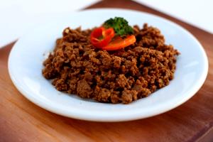 Quantas calorias em 1 Porçoes Carne Moída Molhadinha?