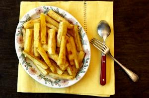 Quantas calorias em 1 Porçoes Mandioca Crocante De Forno?