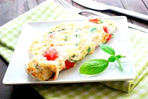 Quantas calorias em 1 Porçoes Omelete Com Queijo Tomate E Manjericão?