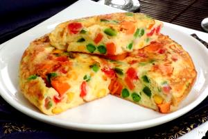 Quantas calorias em 1 Porçoes Omelete De Legumes 2?