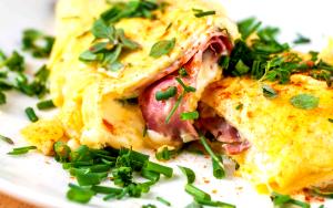 Quantas calorias em 1 Porçoes Omelete De Queijo E Presunto?