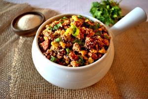 Quantas calorias em 1 Porçoes Tropeiro Nutritivo?