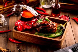 Quantas calorias em 1 Porção (265,0 G) Cordeiro, pernil inteiro, cozido?