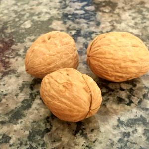 Quantas calorias em 1 Xícara (120,0 G) Nozes pili, secas?