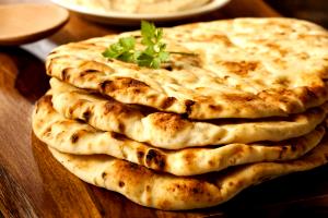 Quantas calorias em 100 G Naan Indiano?