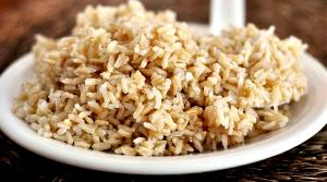 Quantas calorias em 2 colheres de sopa (20 g) Arroz Integral Cozido?